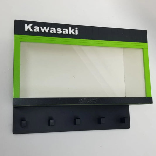Black and green Kawasaki wall key hook rack with four hooks and a rectangular display case frame.