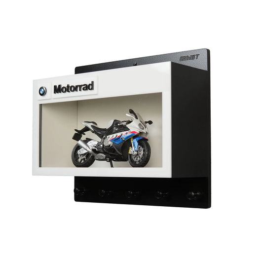 Black and white BMW Motorrad wall key hook rack featuring a detailed motorcycle model inside a display frame.