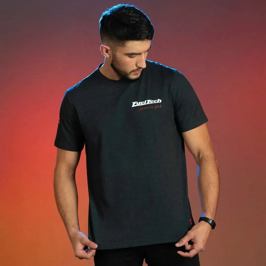 Black crew neck t-shirt with white FuelTech Anderson Dick Chevrolet Opala logo on chest, worn by male model.