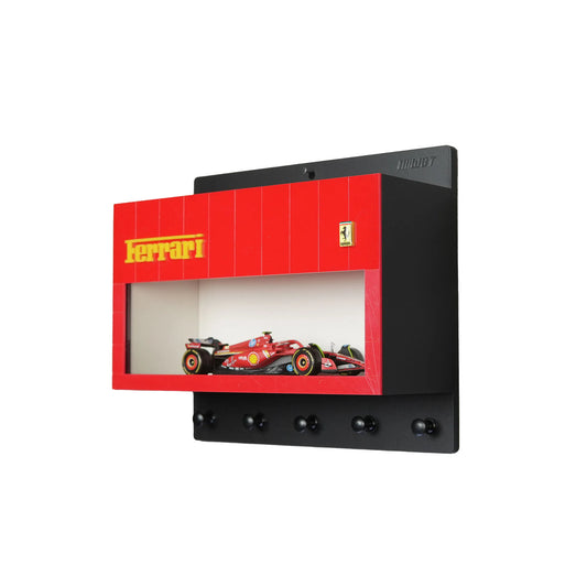 Black wall-mounted key hook rack with four hooks, red Ferrari-themed display case featuring a scale model Formula 1 car.