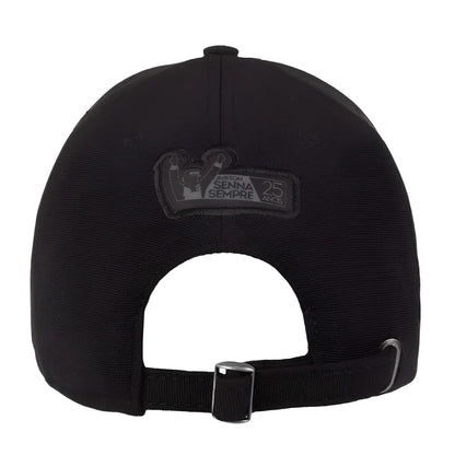 Black adjustable cap with metal buckle and embroidered Ayrton Senna logo on back strap.