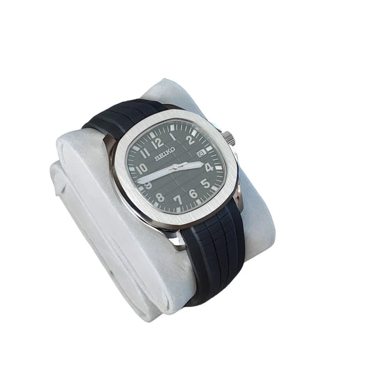 Seiko Aquanaut watch with 40mm silver stainless steel case, black dial, white numerals, and black rubber strap.