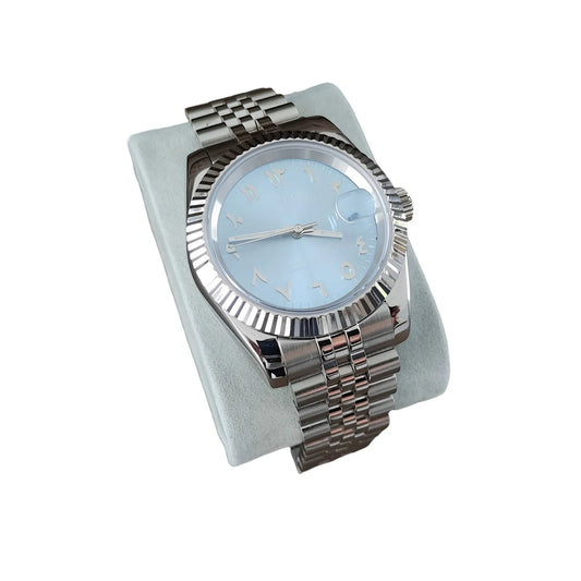 39mm Seiko watch with ice blue dial, chromed Arabic numerals, fluted bezel, and stainless steel bracelet.