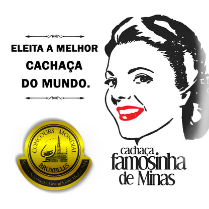 Gold award medallion with black text and a black and white smiling woman illustration with red lips, branding for Cachaca.