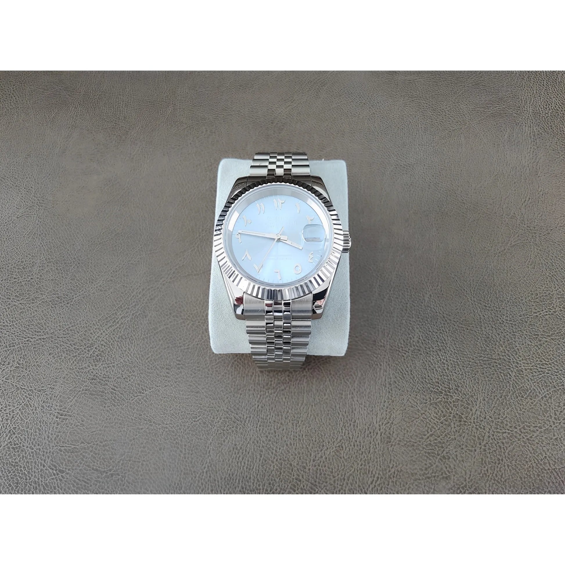 Seiko stainless steel watch with 39mm fluted bezel, ice blue dial, chromed Arabic numerals, and metal link bracelet.