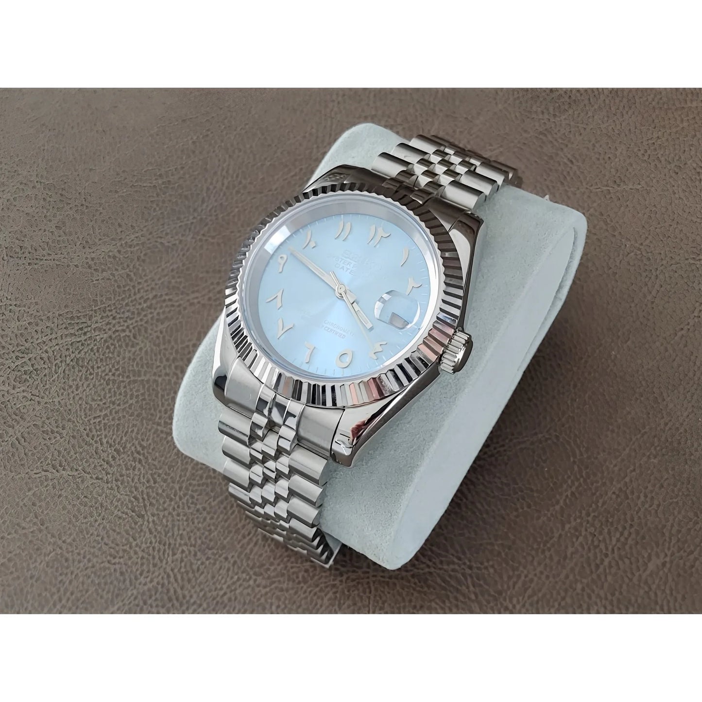 Seiko 39mm wristwatch with ice blue dial, chrome Arabic numerals, fluted bezel, and silver metal bracelet.