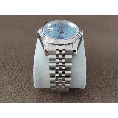 Seiko 39mm watch with ice blue dial, chromed Arabic numerals, fluted bezel, and silver stainless steel bracelet.