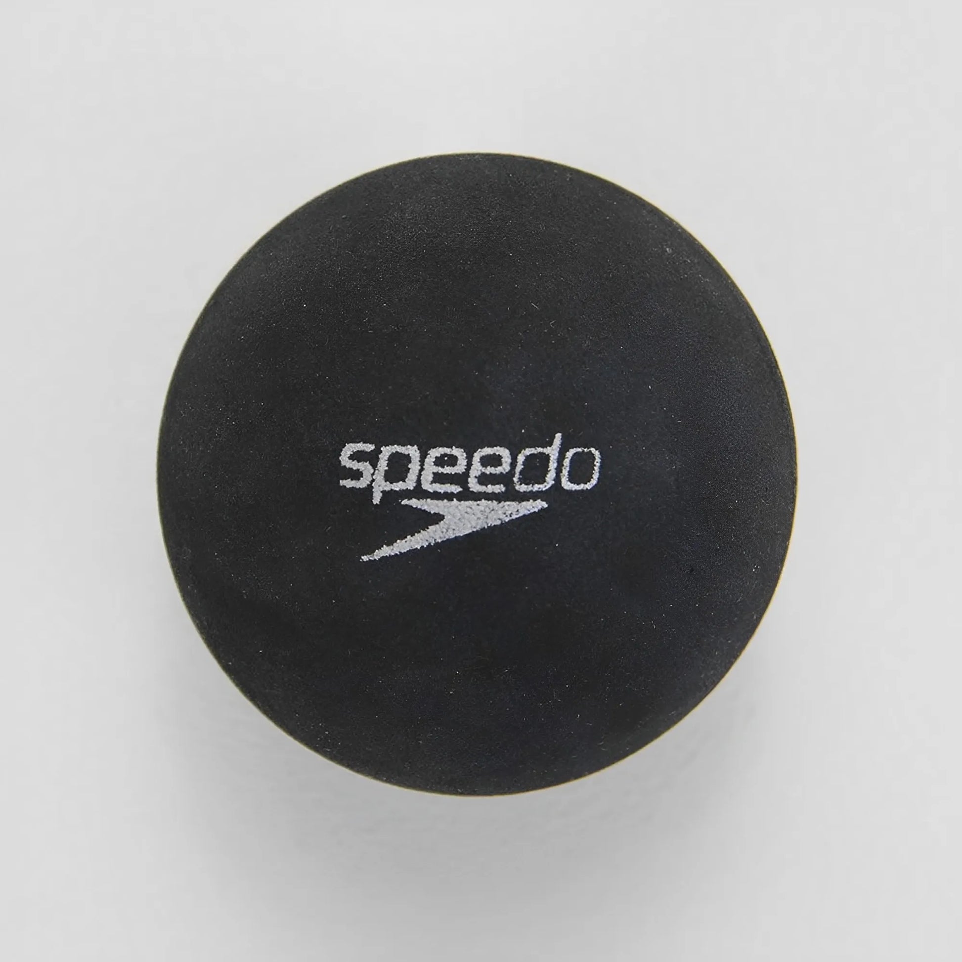 Black rubber paddleball with white Speedo logo centered on the top surface.