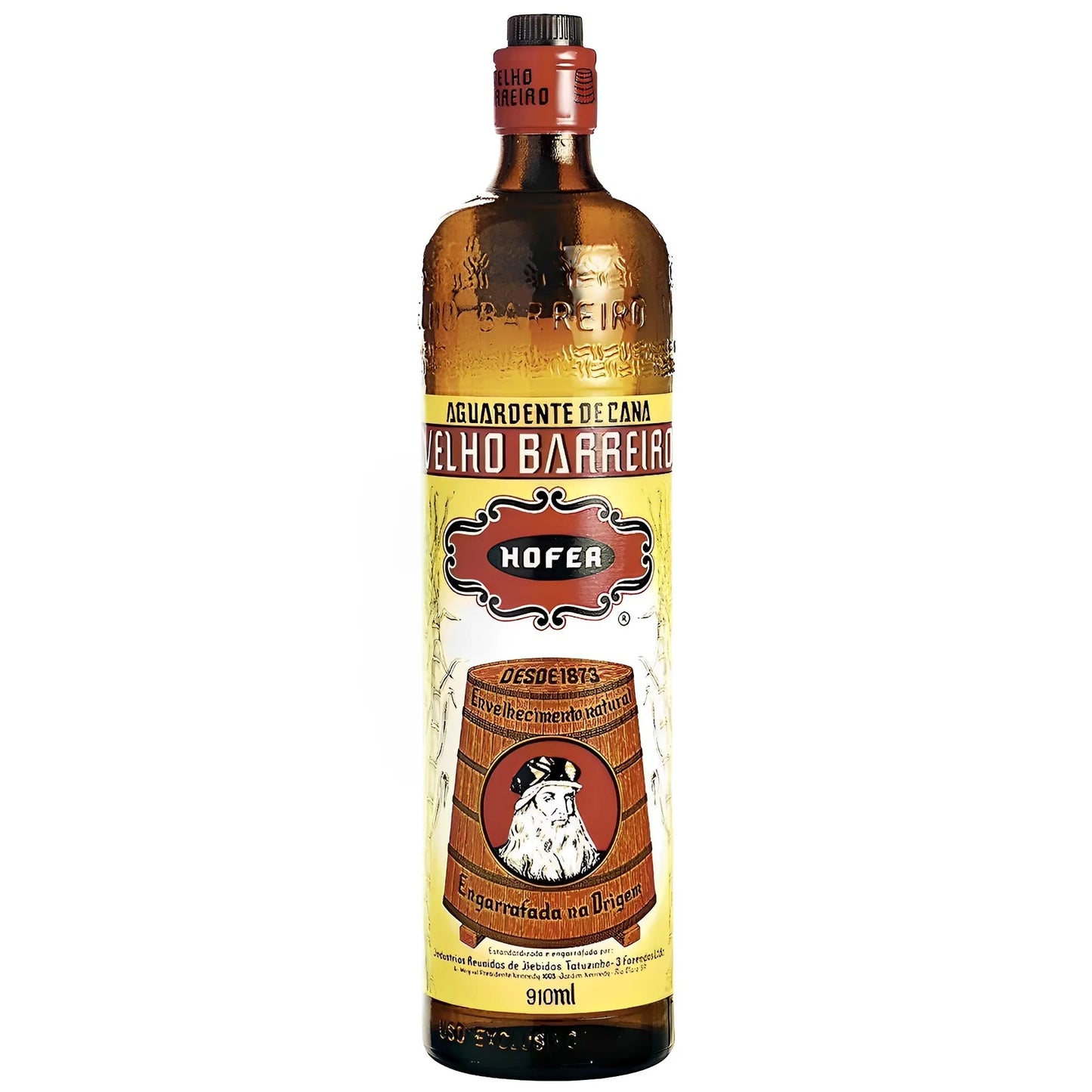 Tall amber glass bottle of Velho Barreiro with yellow label featuring a wooden barrel and red cap.