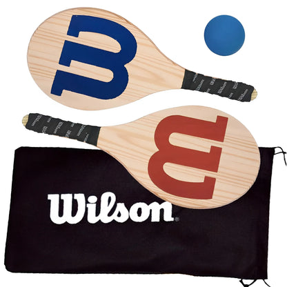 Wooden Wilson Frescobol paddles with blue and red logos, black grips, blue ball, and black Wilson carrying bag.