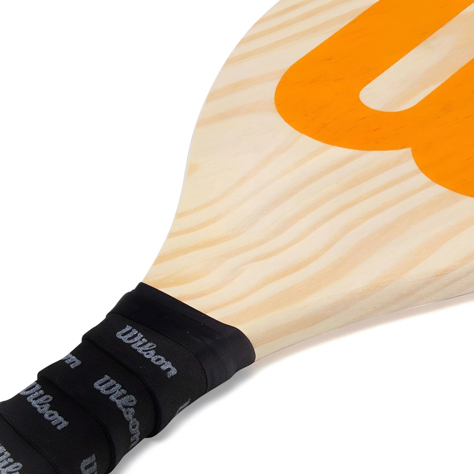 Wooden Wilson Frescobol paddle with light natural grain and large orange "W" logo, black grip wrapped handle.