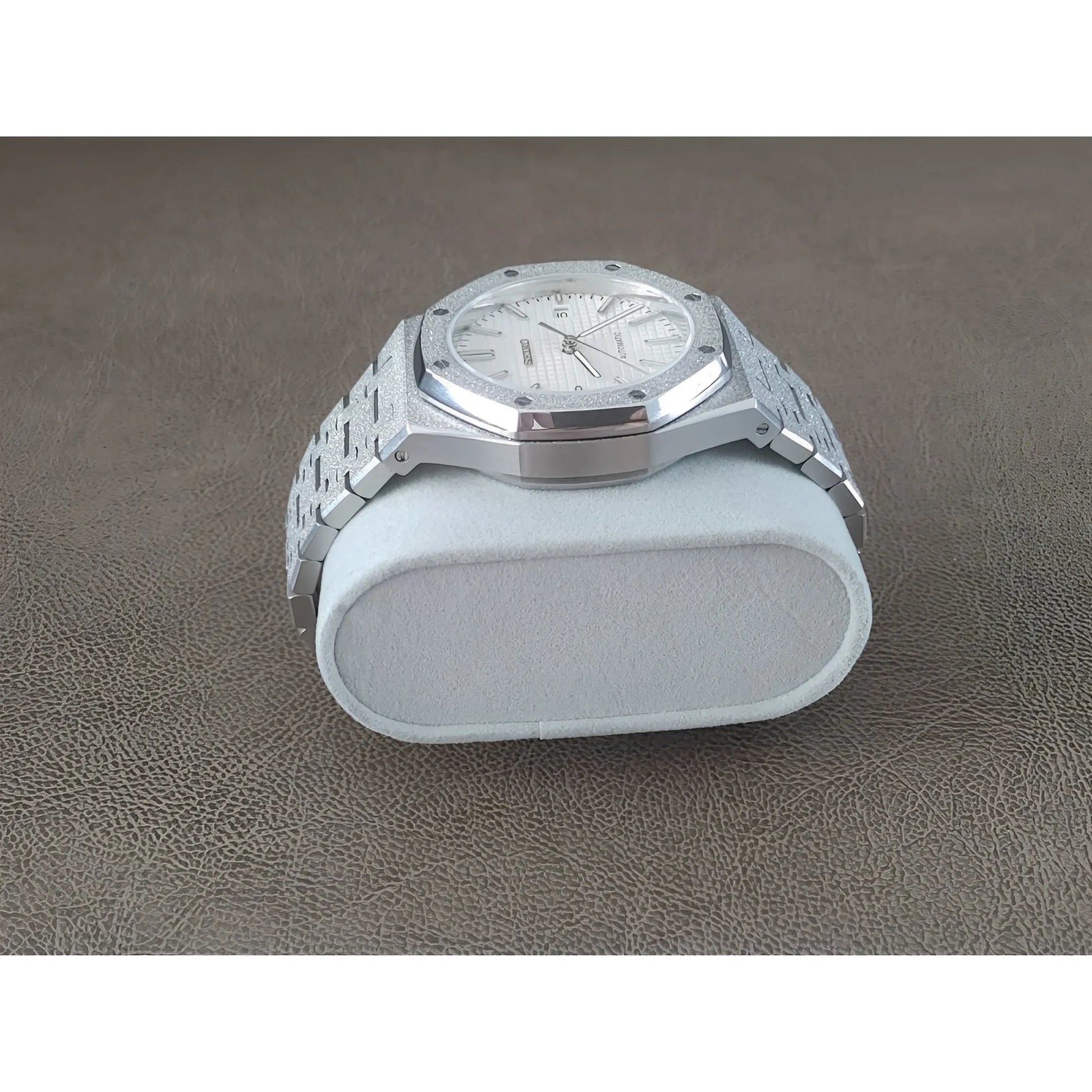 Silver stainless steel watch with frosted white dial and octagonal bezel on metal bracelet.