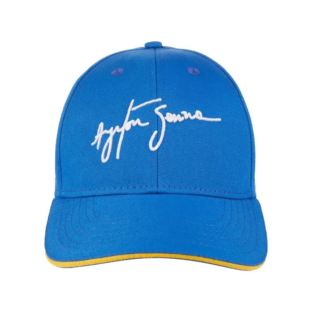 Royal blue cap with white Ayrton Senna signature embroidery and yellow under-visor trim.