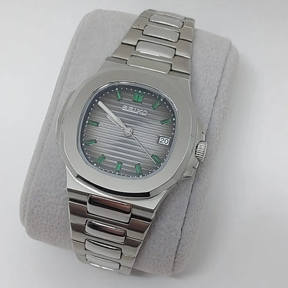 Seiko stainless steel watch with emerald baguette hour markers and horizontal striped gray dial.
