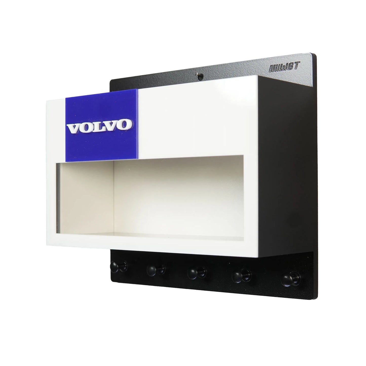 Black and white Volvo wall key hook rack with blue logo and open display shelf.
