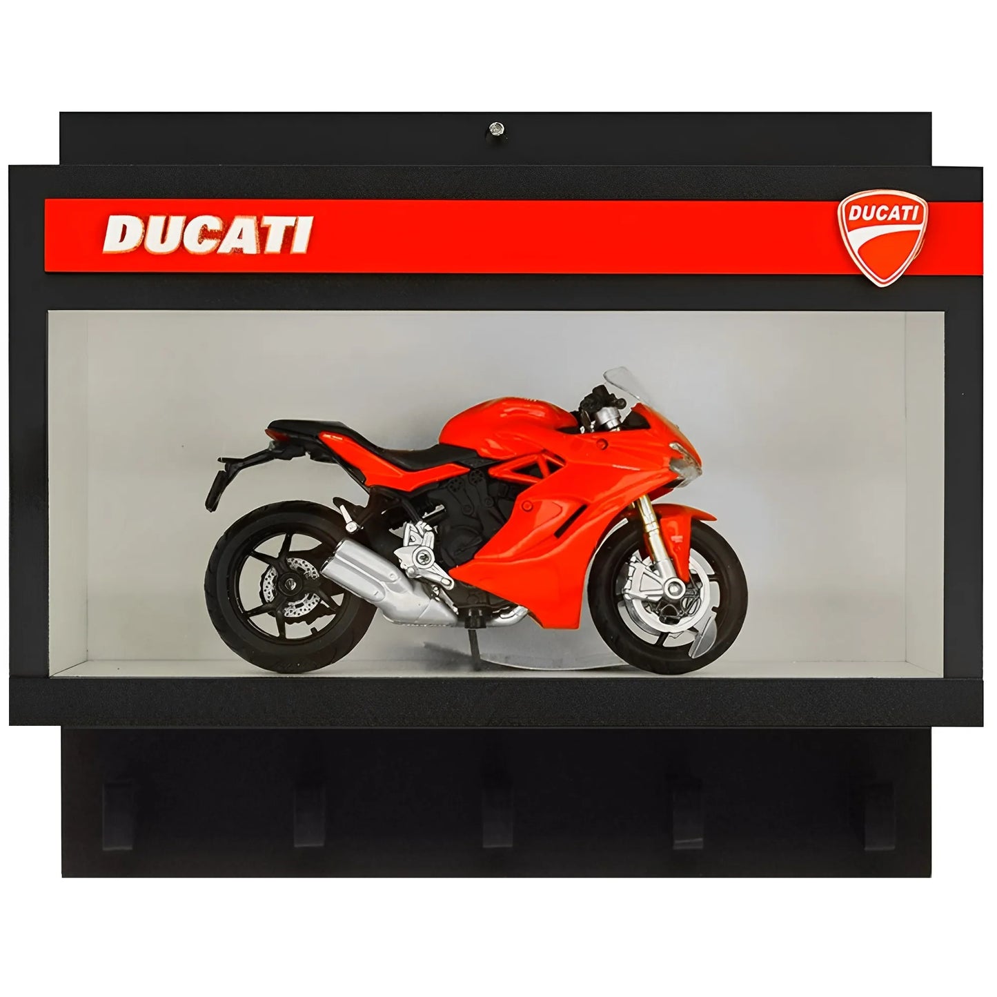 Black wall-mounted key hook rack with red Ducati branding and red sport motorcycle model inside display case.