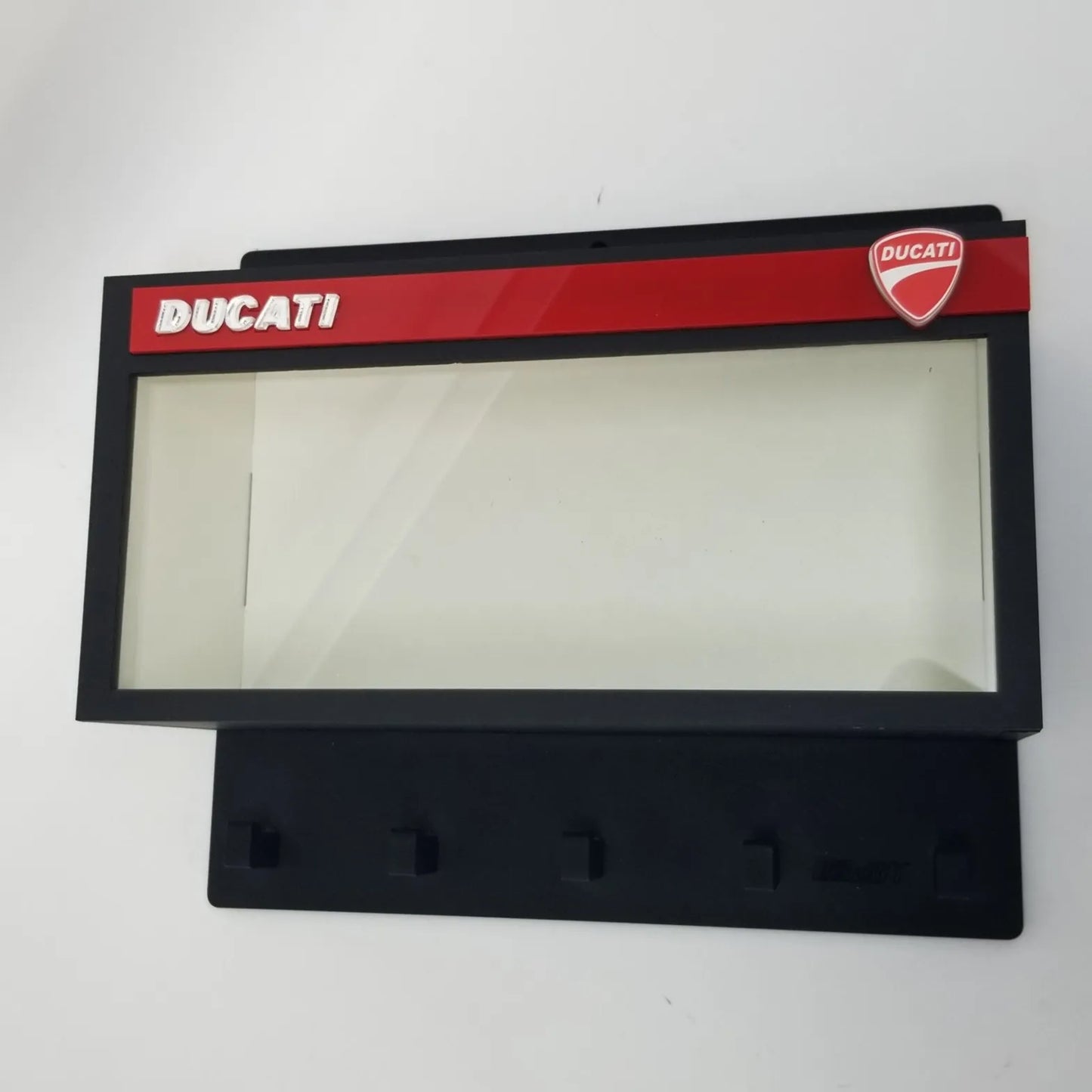 Black and red Ducati wall key hook rack with clear display case and four black hooks.