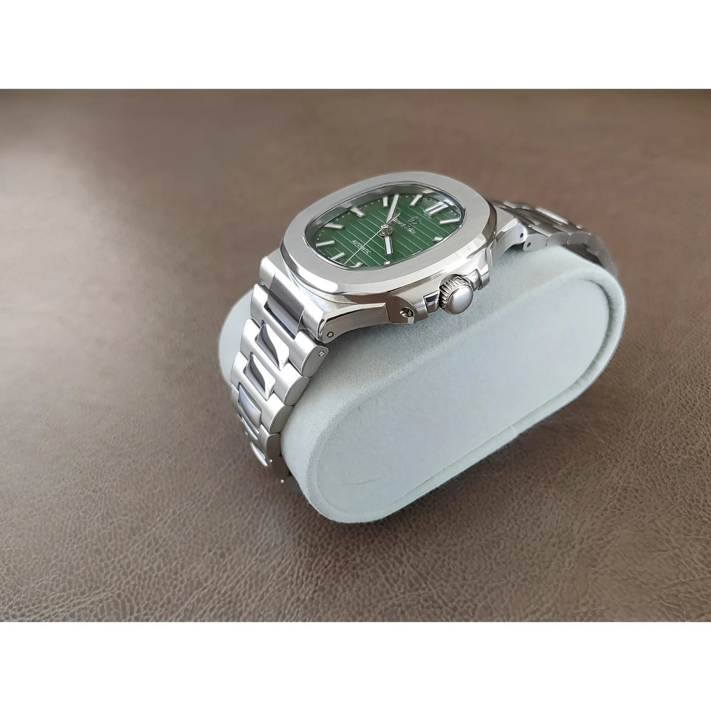Seiko 40mm stainless steel watch with olive green textured dial and silver hour markers on metal bracelet.