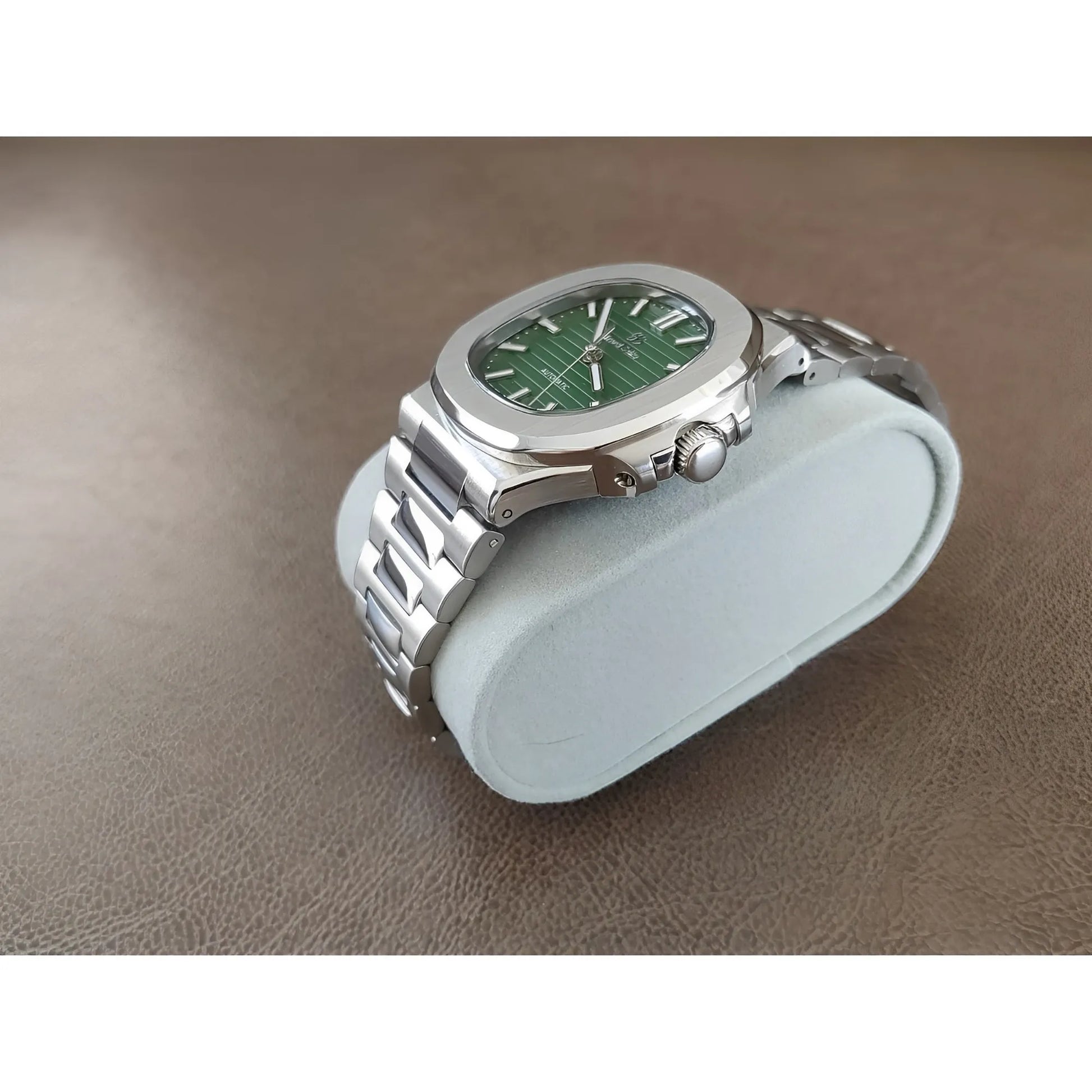 Seiko 40mm stainless steel watch with olive green textured dial and silver hour markers on metal bracelet.