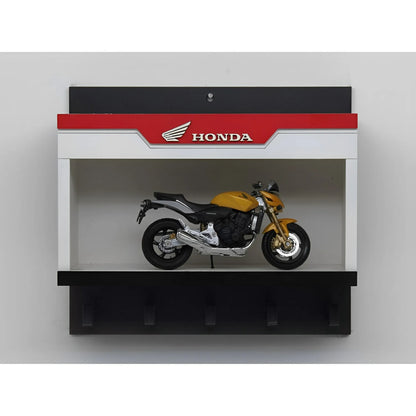 Honda Motorcycles black and red wall key hook rack with yellow scale model motorcycle displayed inside.