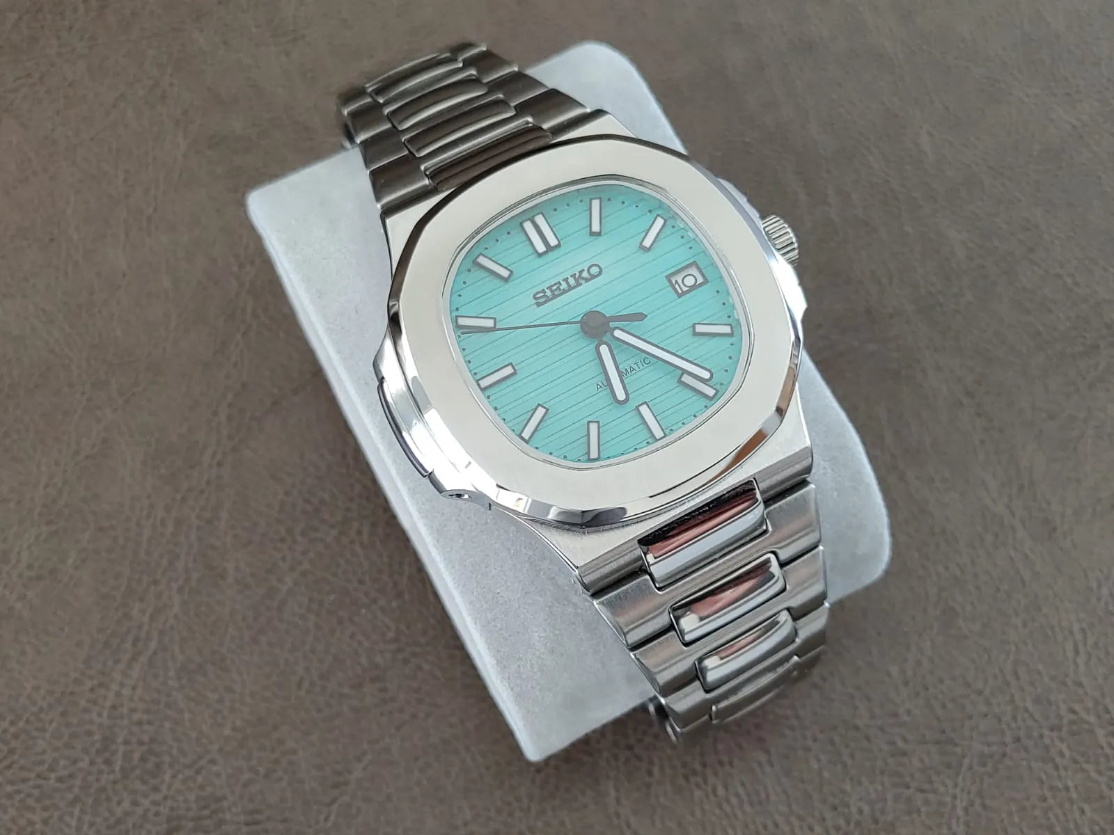 Seiko NH35 Nautilus watch with Tiffany green dial, silver hour markers, and stainless steel bracelet.