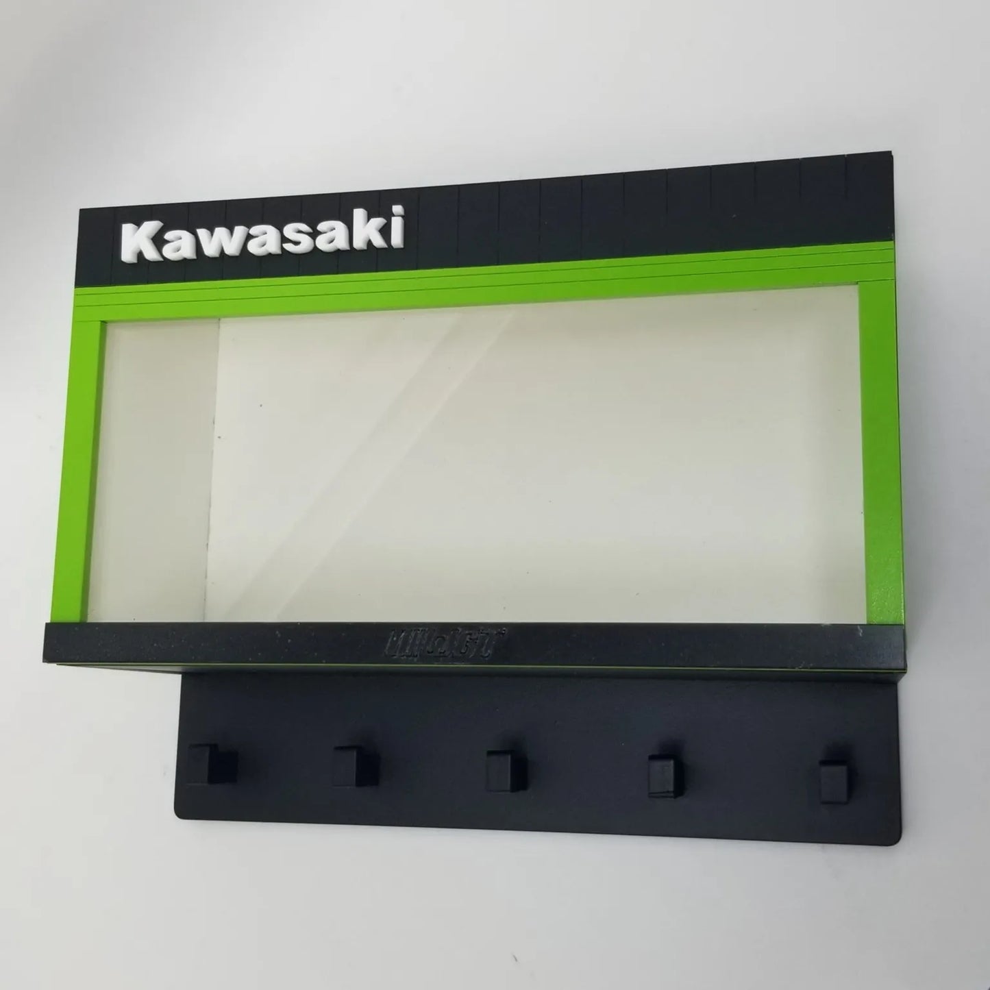 Black and green Kawasaki wall key hook rack with five hooks and clear display case window.
