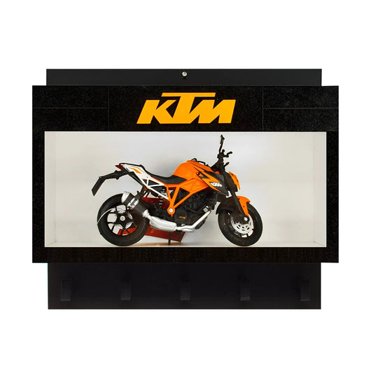 Black wall key hook rack with a clear display case featuring an orange KTM scale model motorcycle and three lower hooks.
