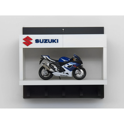 White and black wall key hook rack featuring a detailed blue and silver Suzuki scale model motorcycle and Suzuki logo panel.