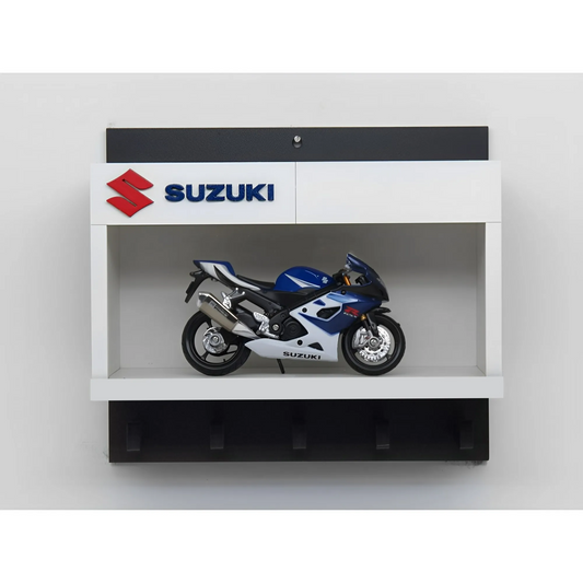 White and black wall key hook rack featuring a detailed blue and silver Suzuki scale model motorcycle and Suzuki logo panel.