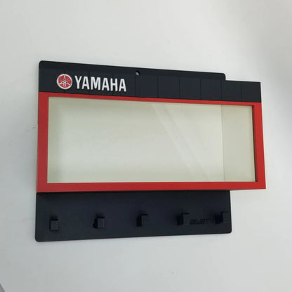 Black Yamaha wall key hook rack with red-bordered glass display window and five hooks.