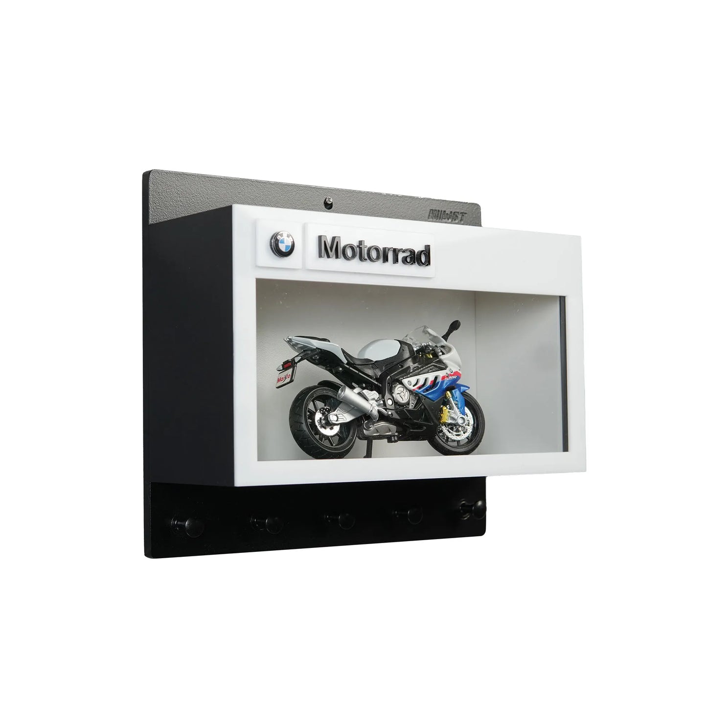 Black and white BMW Motorrad wall key hook rack with a motorcycle model display compartment.