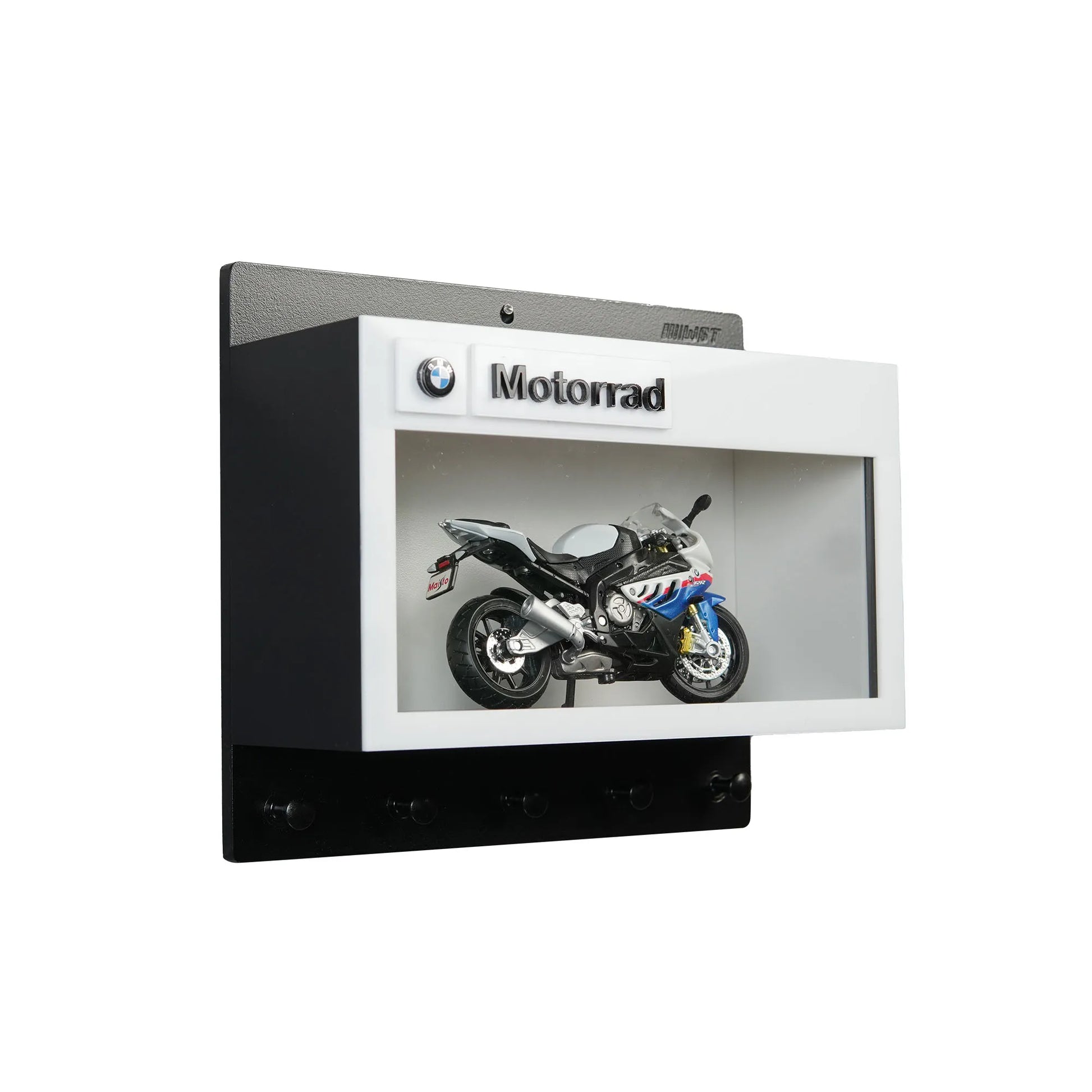 Black and white BMW Motorrad wall key hook rack with a motorcycle model display compartment.