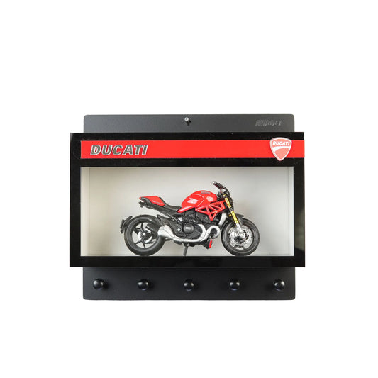 Black wall key hook rack with red Ducati logo and a red and silver scale model motorcycle inside a display case.