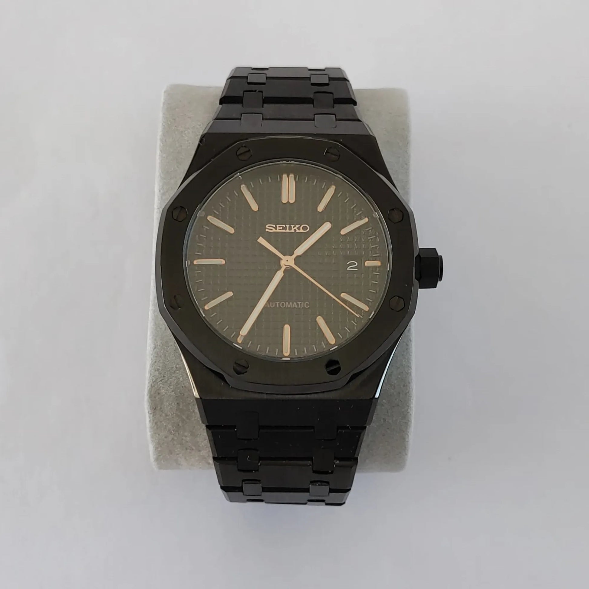 Seiko NH35 black watch with rose gold hour markers and hands, black metal bracelet, 41mm case.