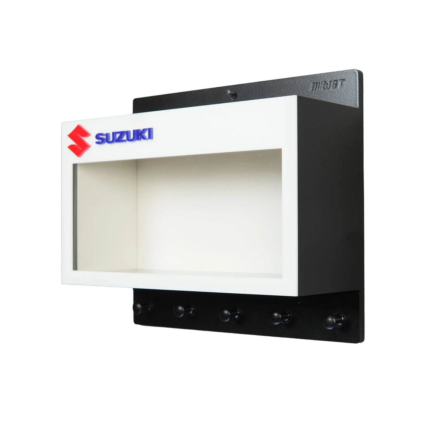 Black and white wall key hook rack with Suzuki logo and open display case compartment.
