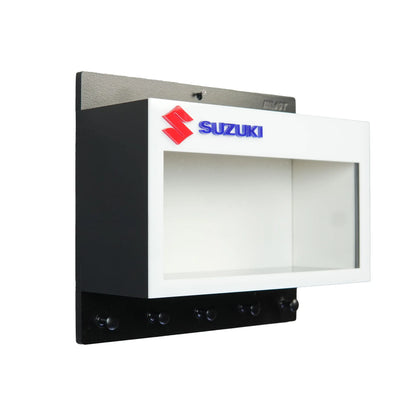 Black and white Suzuki wall key hook rack with built-in scale model motorcycle display case and five black hooks.