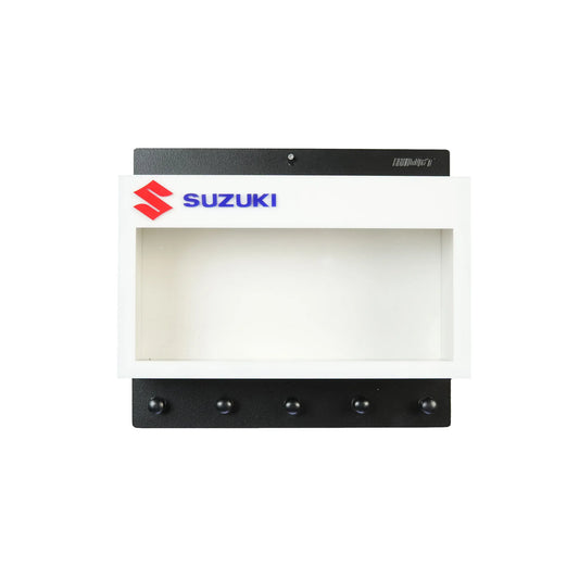 White and black Suzuki wall key hook rack with Scale Model Motorcycle Display Case and five black hooks.
