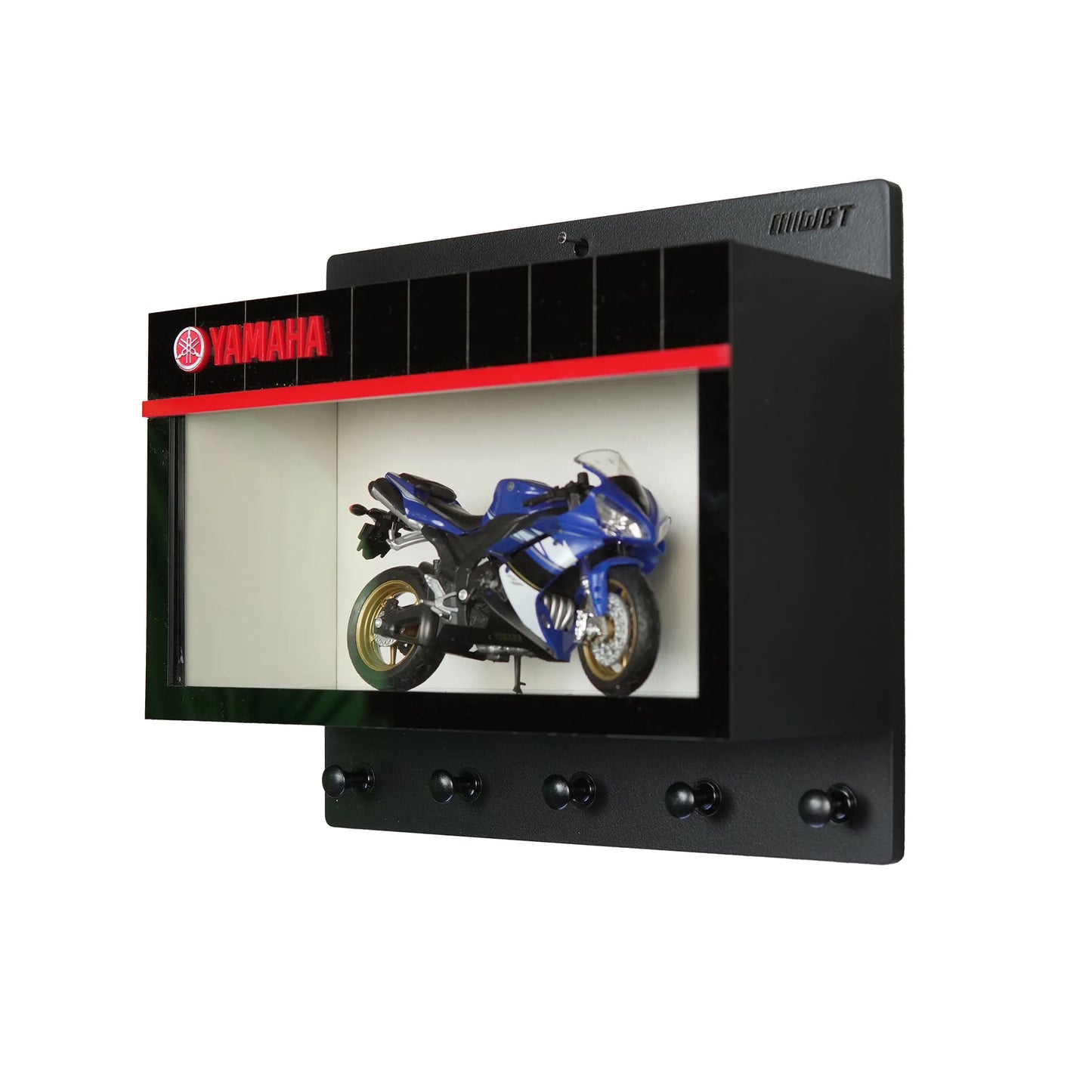 Black Yamaha wall key hook rack with red logo and blue scale model motorcycle display case.