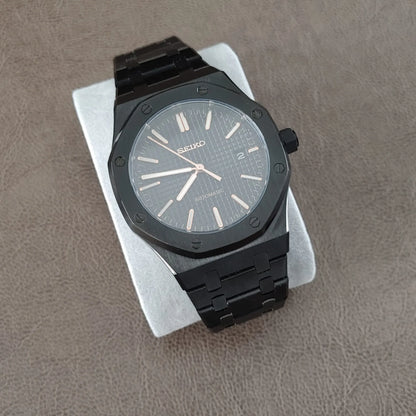Black stainless steel Royal Oak style watch with 41mm octagonal bezel and rose gold hour markers and hands on textured black