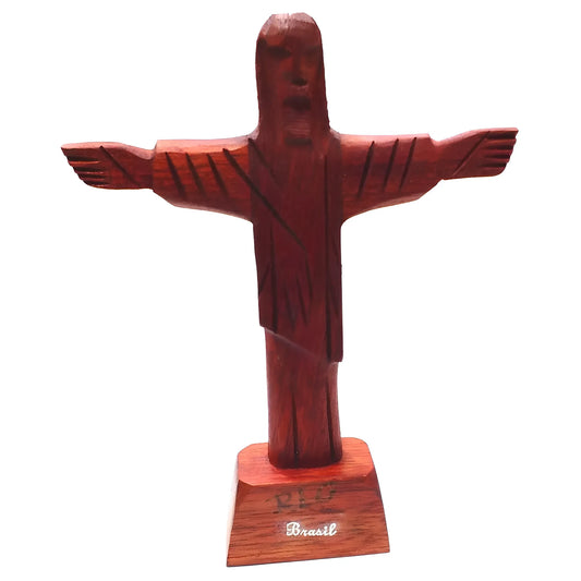 Carved Brazilwood Cristo Redentor statue with outstretched arms on rectangular base.