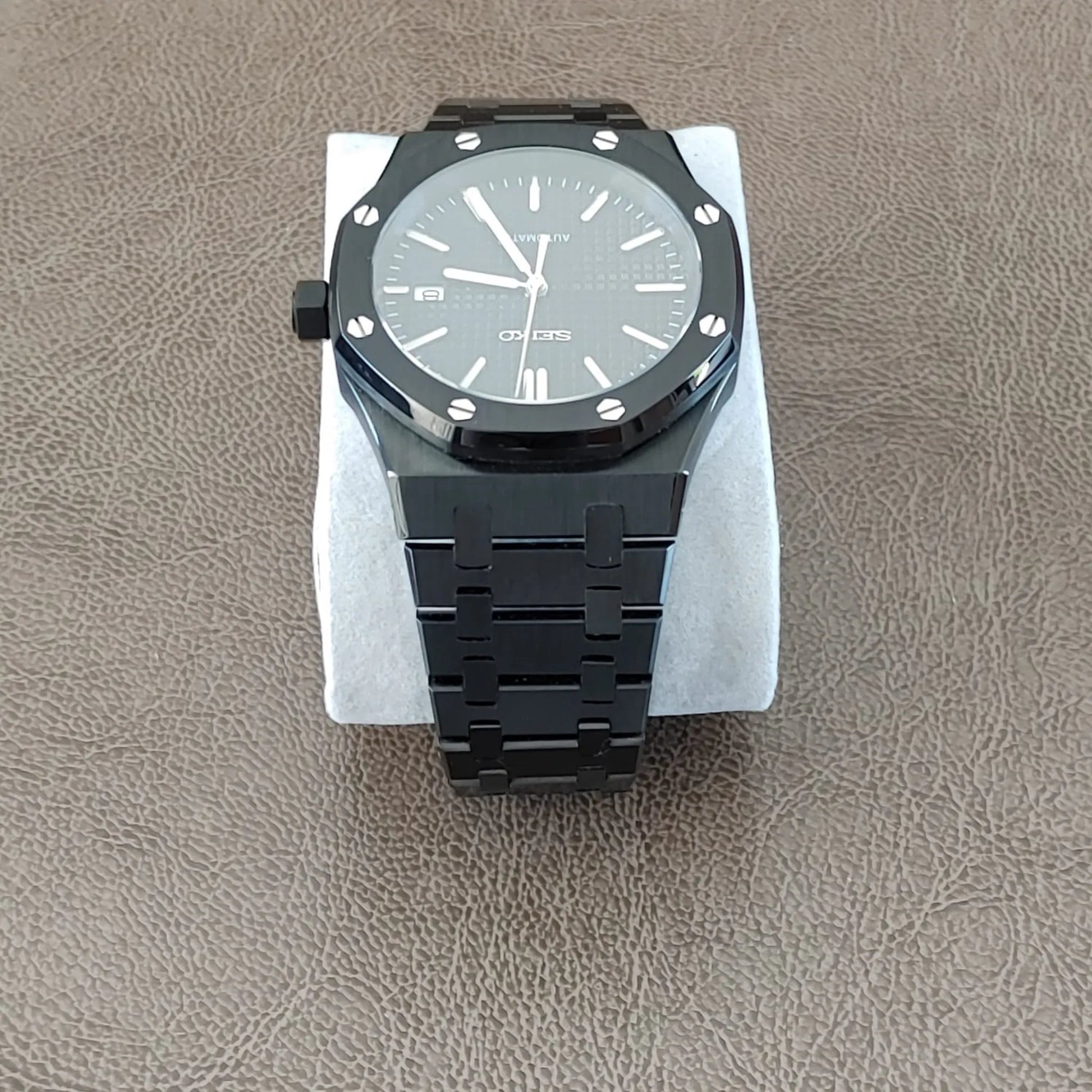 Seiko NH35 Royal Oak-style 41mm watch with black dial, silver hour markers, and black metal bracelet.