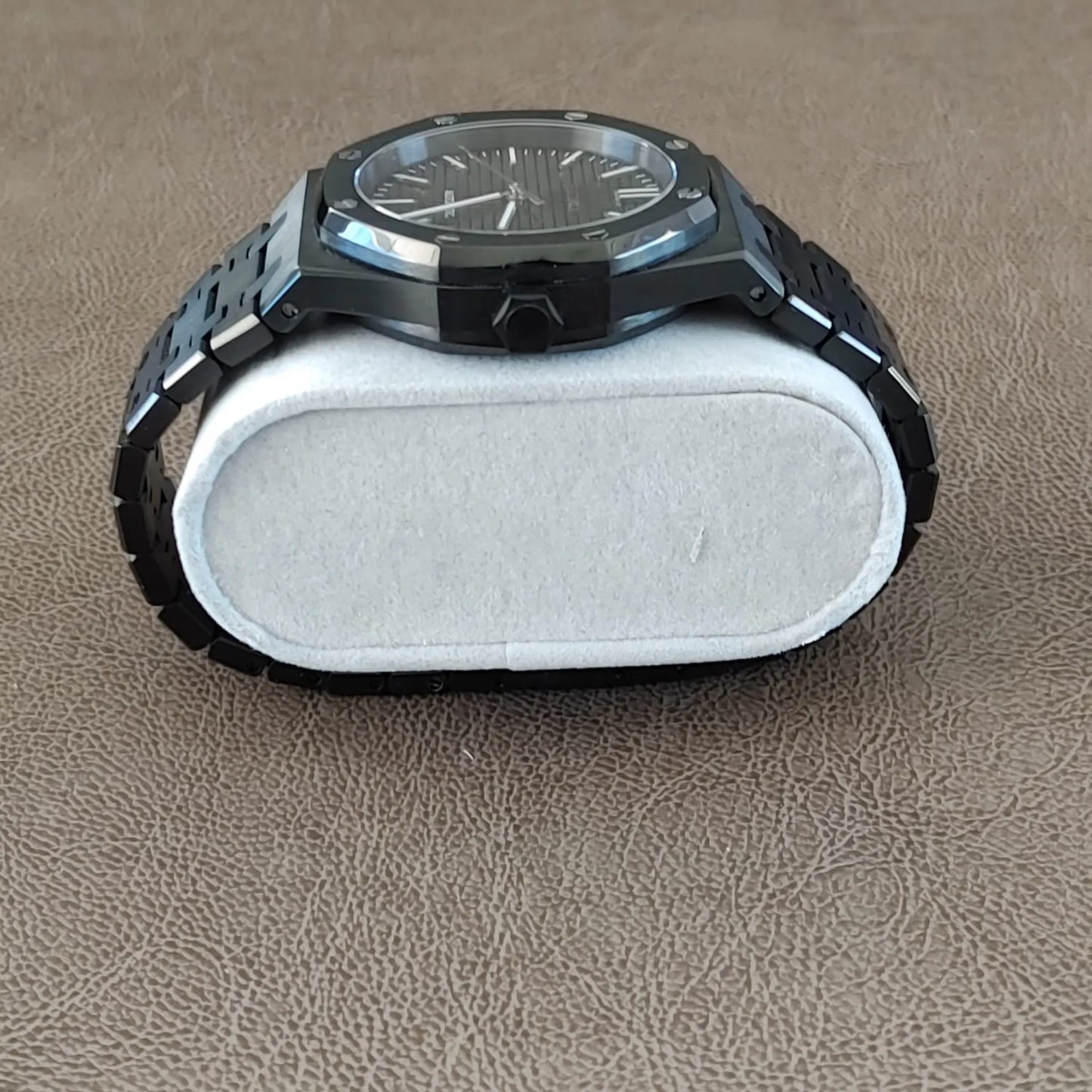 Seiko NH35 Royal Oak 41mm watch with black dial, silver hour markers, and black stainless steel bracelet.