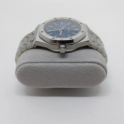 Silver stainless steel watch with octagonal bezel, navy blue dial, and silver bracelet.