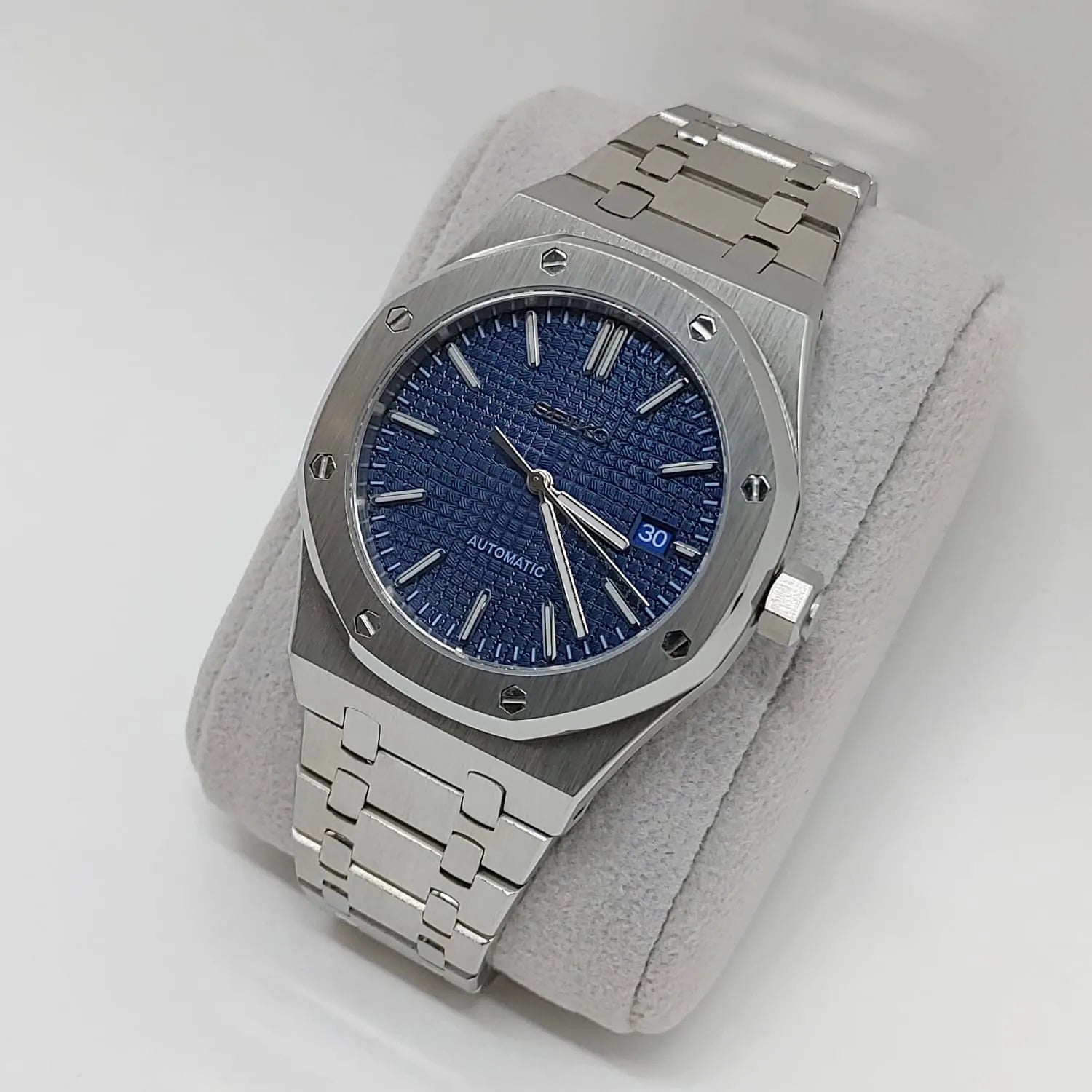 Seiko Royal Oak style watch with 41mm silver stainless steel case and bracelet, navy blue textured dial, silver hour.