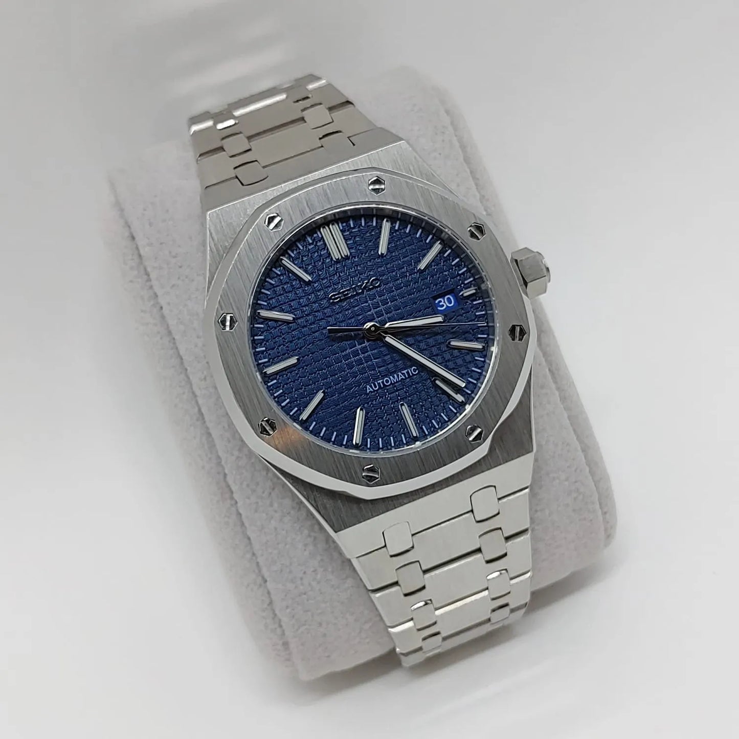 Seiko NH35 Royal Oak watch with 41mm octagonal stainless steel case, navy blue textured dial, and silver metal bracelet.