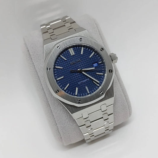 Seiko NH35 Royal Oak watch with 41mm octagonal stainless steel case, navy blue textured dial, and silver metal bracelet.