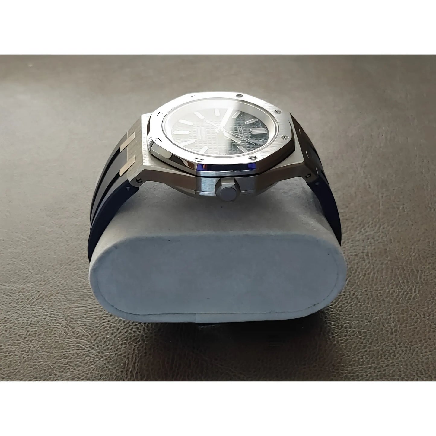 Seiko Royal Oak style watch with a 41mm silver stainless steel case, navy blue dial, and textured rubber strap.