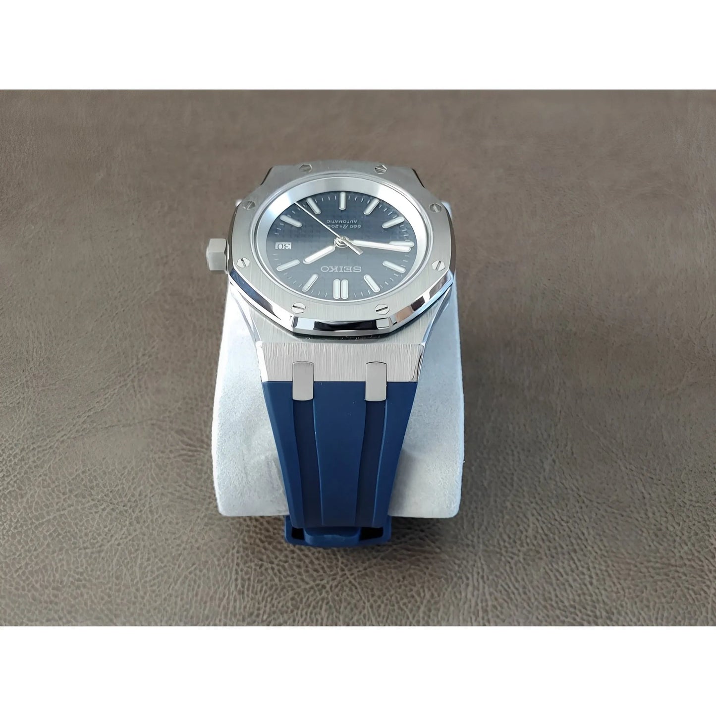 Seiko NH35 Royal Oak style watch with navy blue dial and rubber strap, silver-tone case.