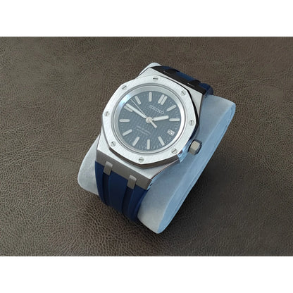 Seiko Royal Oak style watch with 41mm silver case, navy blue dial, and matching rubber strap.
