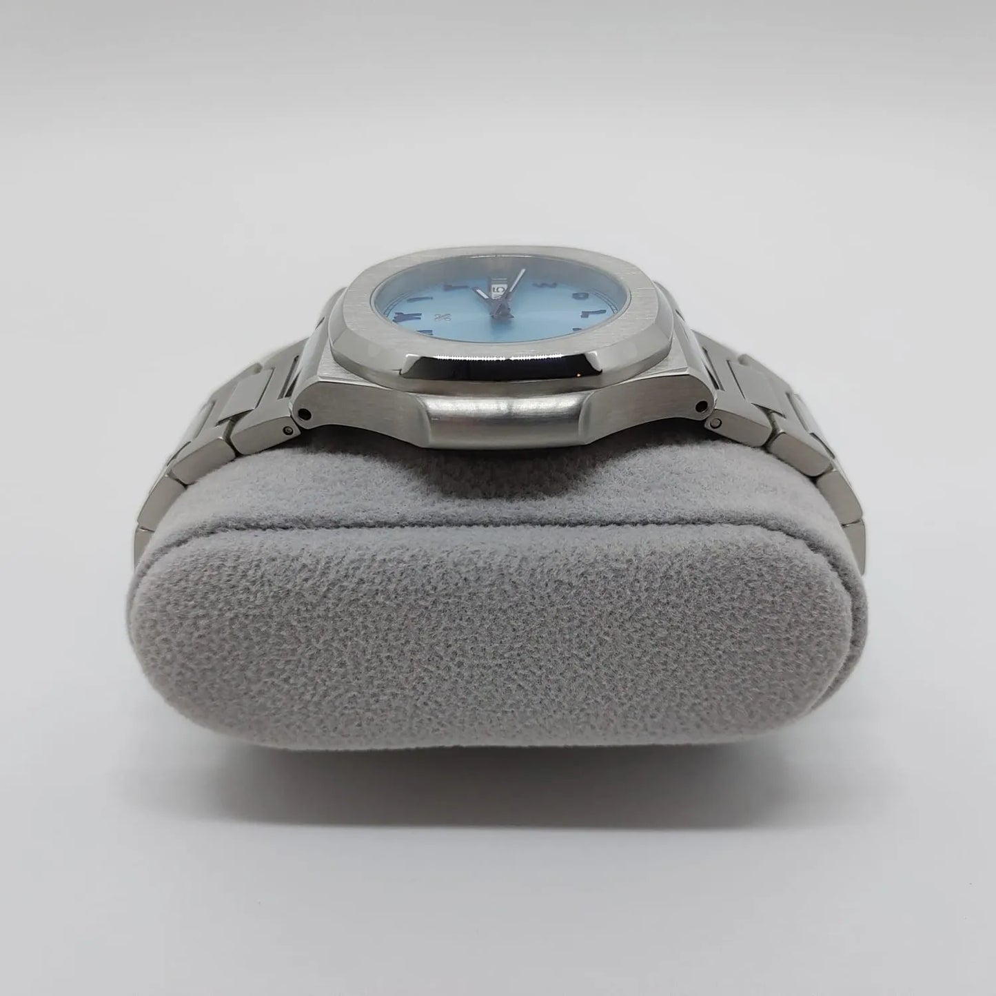 Stainless steel watch with 40mm ice blue dial and Arabic numerals, metal bracelet, day-date window.